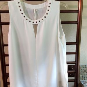 Sleeveless off-white top by Bellatrix with stud detail at neckline.  Size medium